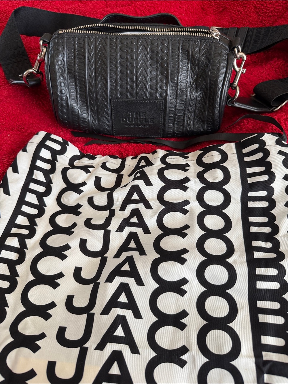 The Sak Black Embossed Leather Crossbody Belt Bag and cloth bag